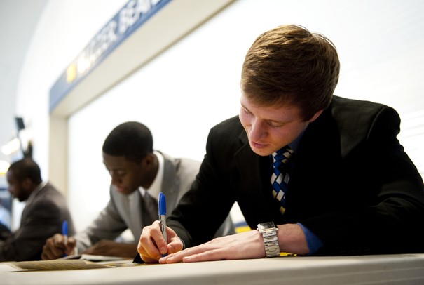 Michigan freshman Spike Albrecht signs autographs for fans before the basketball banquet on Tuesday, April 16. AnnArbor.com I Daniel Brenner